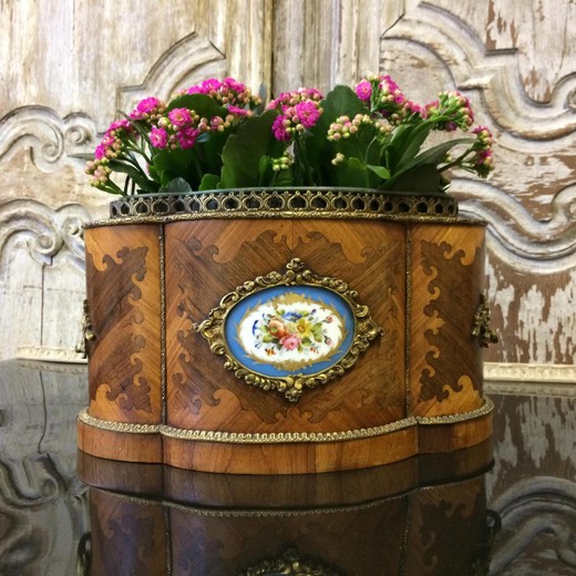 Antique pots in the style of Louis XV. It is made of mahogany. Decorated with patches of gilded bronze. France, XIX century.