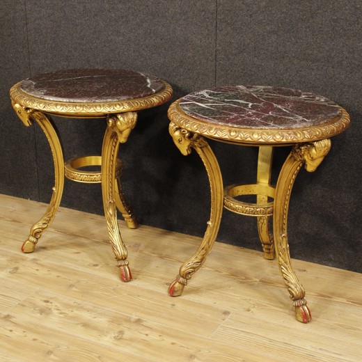 Antique paired tables in the style of Napoleon III. Made of wood with gilding. The worktops are marble. France, the 20th century.