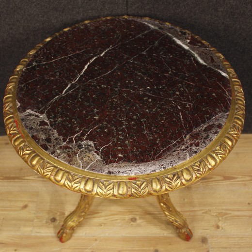 Antique paired tables in the style of Napoleon III. Made of wood with gilding. The worktops are marble. France, the 20th century.