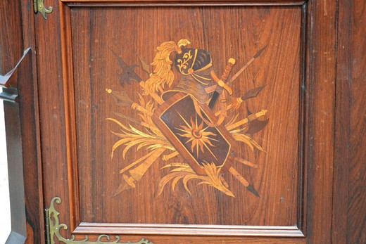 Antique showcase in the Gothic style. It is made of rosewood in the marquetry technique. France, XIX century.