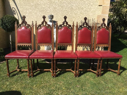 A set of antique chairs in the Gothic style. Made of walnut. Upholstery - the skin. France, XIX century.