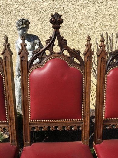 A set of antique chairs in the Gothic style. Made of walnut. Upholstery - the skin. France, XIX century.