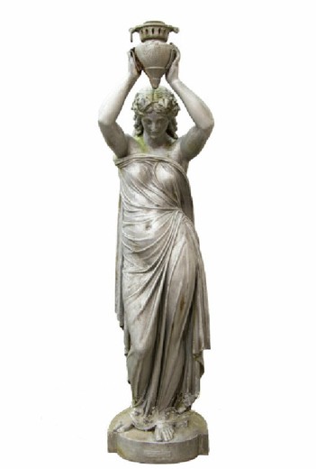 Antique garden sculpture "Girl with a jug". It is made of metal. Europe, the twentieth century.