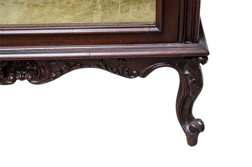 Antique showcase in the style of Louis XV. It is made of mahogany. Europe, the 1880s.