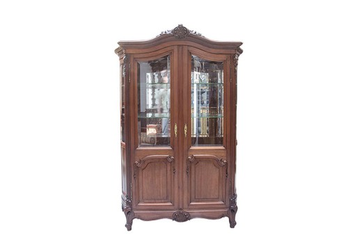 Antique showcase in the style of Louis XV. It is made of mahogany. Europe, the 1880s.