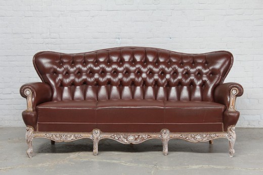 Antique sofa in the style of Louis XV. Made of walnut. Upholstery - the skin. France, 1940's.