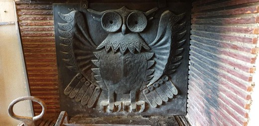 antique fireplace plate made as an owl