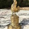 Antique singing rooster sculpture