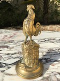 Antique singing rooster sculpture