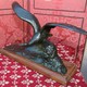 Antique sculpture of a seagull on a wave