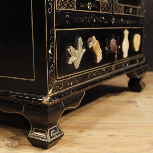 Antique twin cabinets in the oriental style of wood with soapstone furniture with minerals