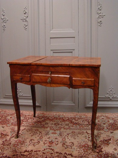 Antique dressing table in the style of Louis XV. Made of wood in marquetry. France, XIX century.