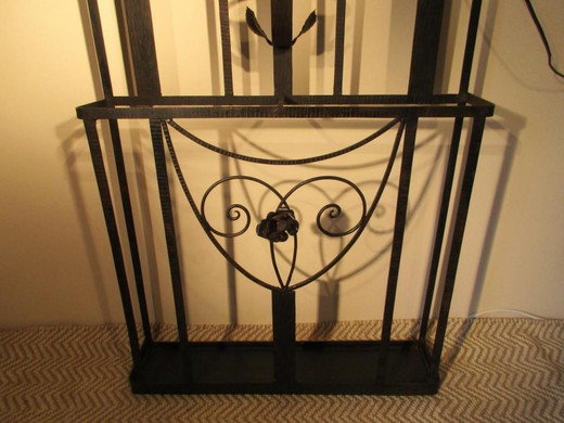 Antique coat rack with a mirror in the art deco style. It is made of metal. France, the 20th century.