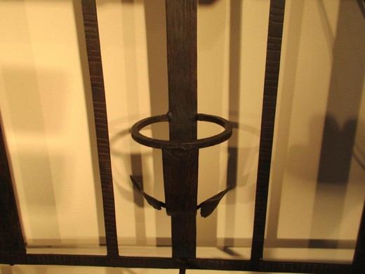 Antique coat rack with a mirror in the art deco style. It is made of metal. France, the 20th century.