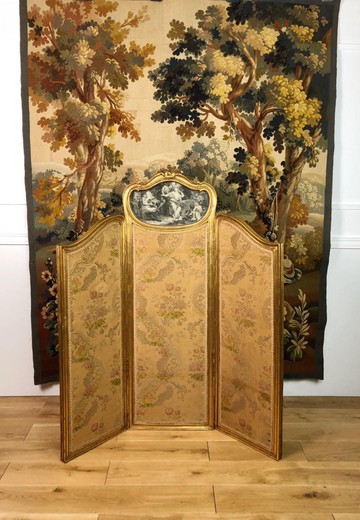 Antique screen in the style of Louis XV. Made of gilded wood. France, XIX century.