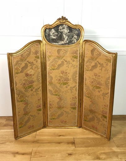 Antique screen in the style of Louis XV. Made of gilded wood. France, XIX century.