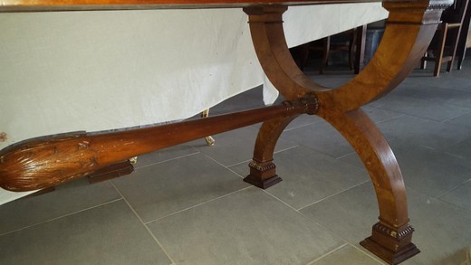 Antique table in the style of Empire. Made of walnut. France, the 20th century.