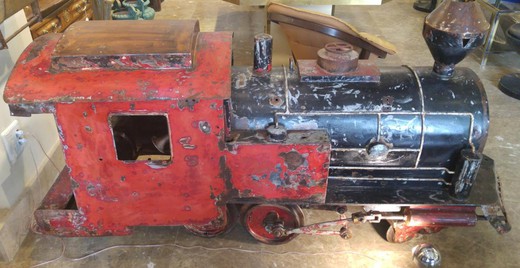 Large antique model of the locomotive. It is made of metal. France, the 20th century.