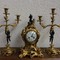 Antique clock and pair of candelabra
