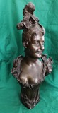 Antique sculpture of a lady with a hairpiece