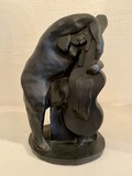 Antique sculpture of a lady with violin
