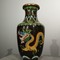 A small vase with a dragon