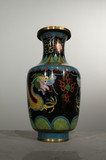 A small vase with a dragon