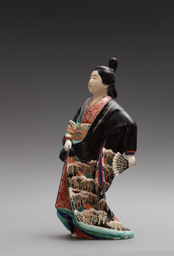 Antique sculpture of a beautiful Japanese with a fan