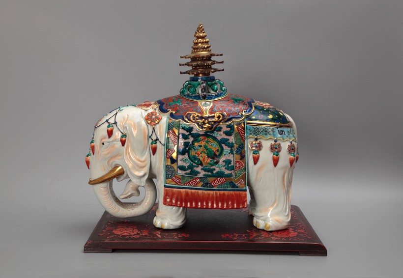 Sculpture of an elephant with a pagoda on the back