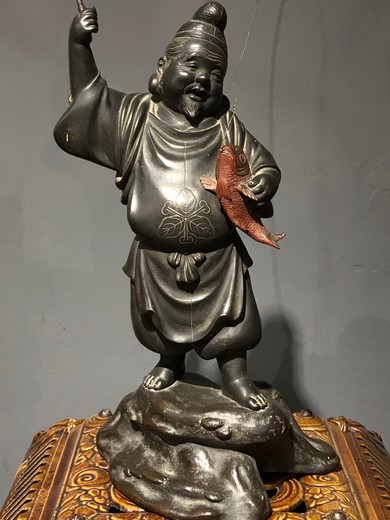 Antique sculpture "God Ebisu with fish"