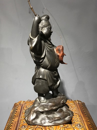 Antique sculpture "God Ebisu with fish"