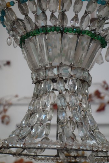 an antique chandelier in the style of Charles X, an antique chandelier with pearls, an antique bronze chandelier, an antique glass chandelier, an antique gallery, an antique shop, an antiquarian light, an antiques shop