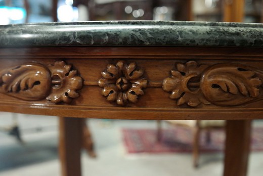 an antique table of walnut with marble