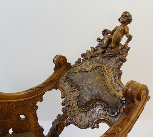 an antique rocking chair, an old rocking chair in the Renaissance style, a vintage rocking chair made of wood, an antique gallery, a Renaissance antiques shop, Renaissance antique furniture, Renaissance vintage furniture, 19th century antique furniture