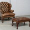 Antique armchair and footstool Chesterfield