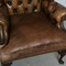 Antique armchair and footstool Chesterfield