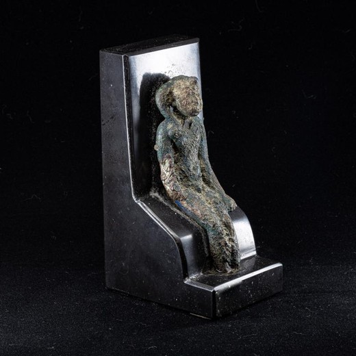 Antique bronze sculpture of an ancient god Harpocrate