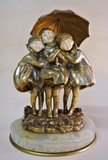 Antique sculpture "Three girls under an umbrella"