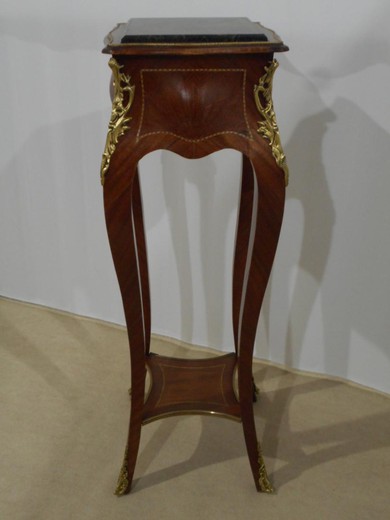 an antique pedestal in the style of Louis XV