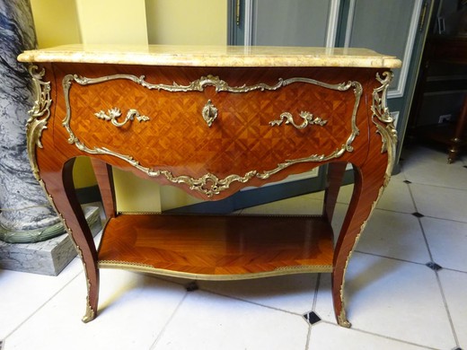 an antique Louis XV console