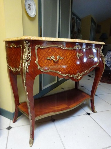 an antique wood console