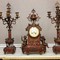 Antique clock with a pair of candelabras
