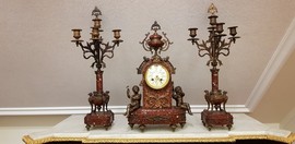 Antique clock with a pair of candelabras