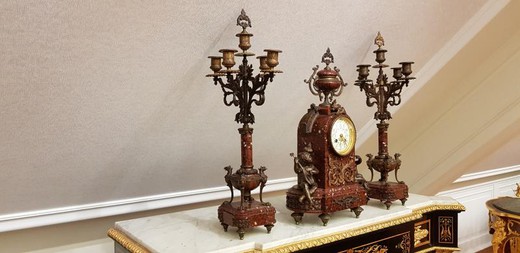 Antique clock with a pair of candelabras