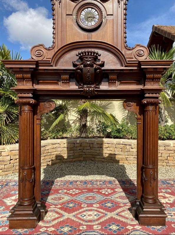 Antique fireplace portal with a clock