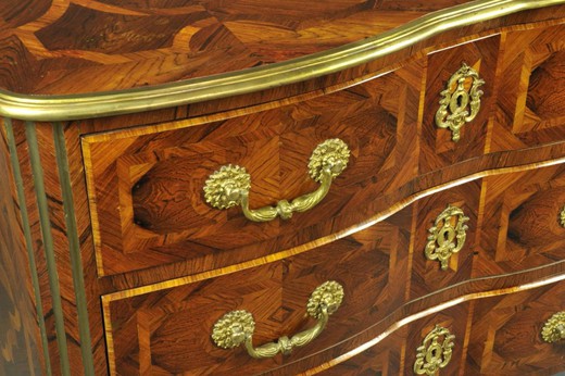 an antique chest of drawers in the style of Louis XIV