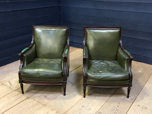Paired leather armchairs in the style of Louis XVI