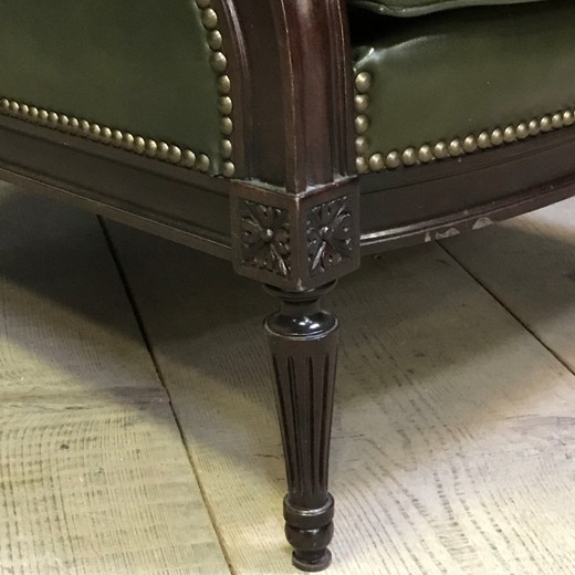 Paired leather armchairs in the style of Louis XVI
