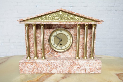Antique clock with paired decorations