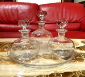 Set of three decanters on a tray